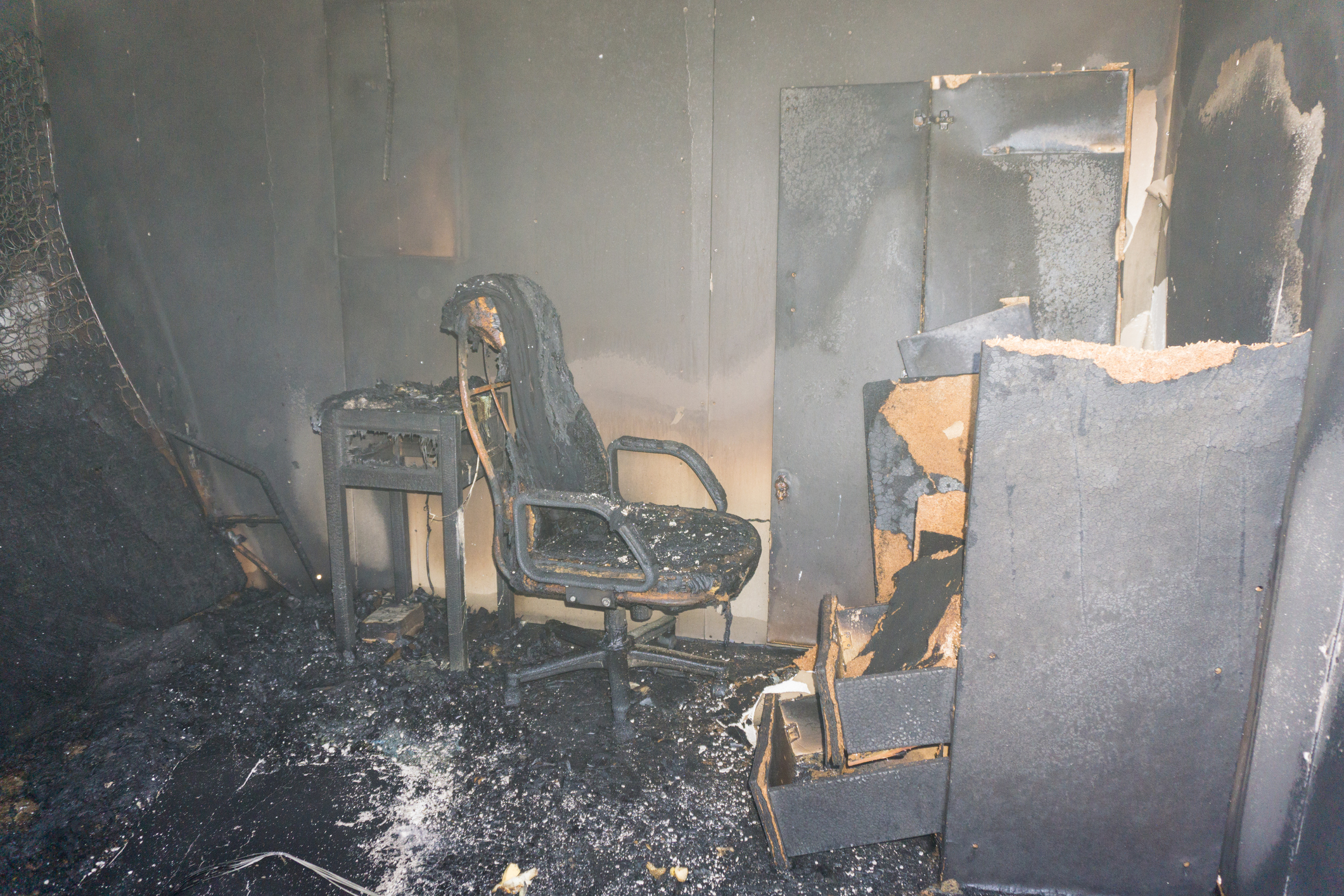 chair and furniture in room after burned by fire with smoke and dust in burn scene